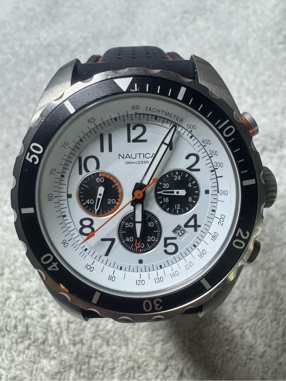 Nautica White Dial Chronograph Watch with Black Bezel and Orange Accents